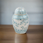 Small keepsake urn etched with doves in white and blue