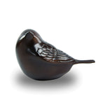 Small bronze songbird keepsake for ashes with intricately detailed feathers.